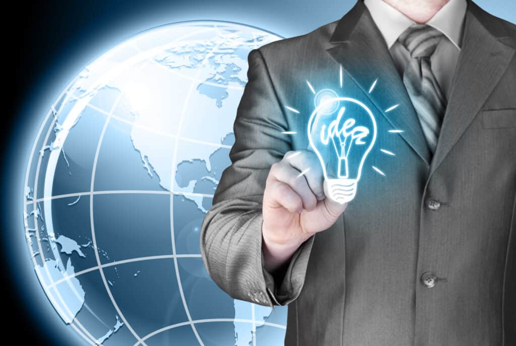 Business man touching light of idea